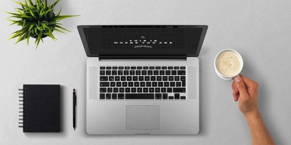 Laptop, coffee, arm — Caring for Hearts: Dr. Hari Saini's Vigilance in Cardiac Wellbeing