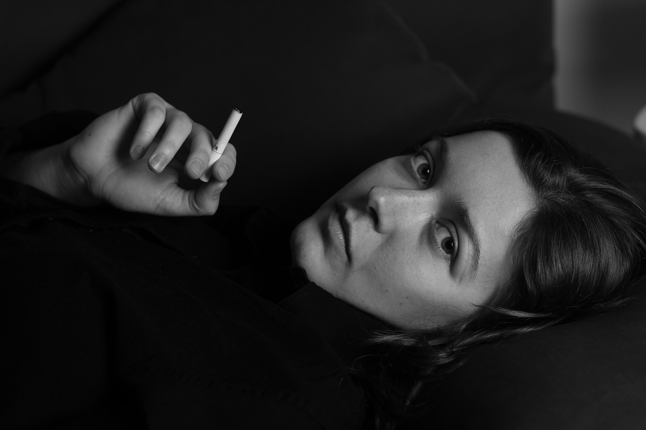 Woman, cigarette, smoking — Dr. Sudipta Mohanty Holistic Lifestyle Solutions for Migraine Management